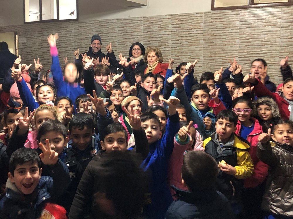 Syria+Appeal+March+2019+That+is+Mike+waaaaay+in+the+back+behind+this+sea+of+children+at+Qamishli+school.jpg